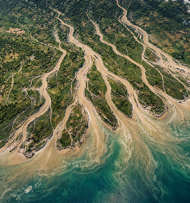 Branching river channels representing ML arteka unifying fragmented data into one foundation.
