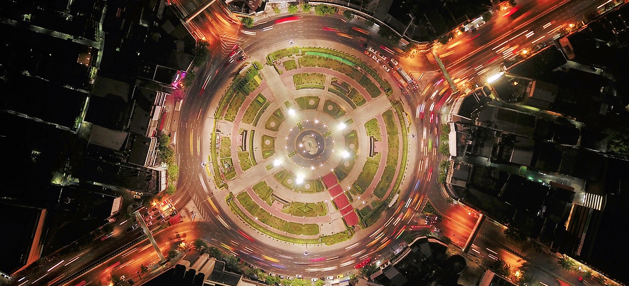 Aerial night view of a financial district representing ML arteka's financial management services