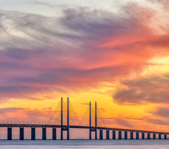 Bridge at sunset representing ML arteka's path from legacy systems to scalable cloud.